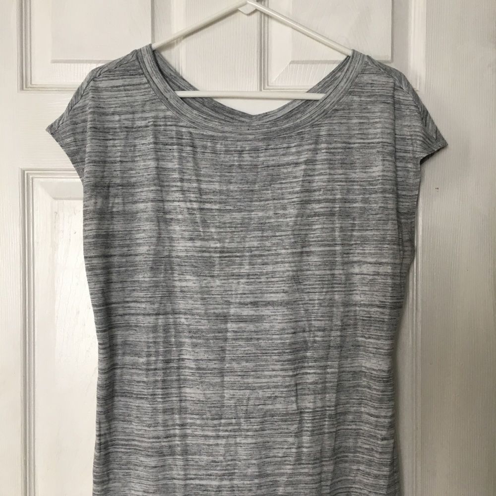 Grey shirt, cut out back